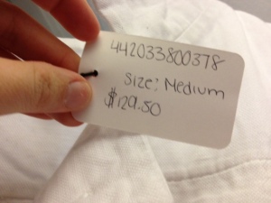 The tag on the Calvin Klein Coat that says the boutique was selling it for $129.50! That's just crazy!